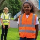School wear hi vis vest for enhanced visibility safety worn over school uniform